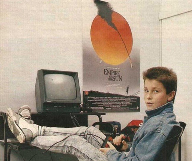Christian Bale playing with his Amstrad computer.  Young Celebrity