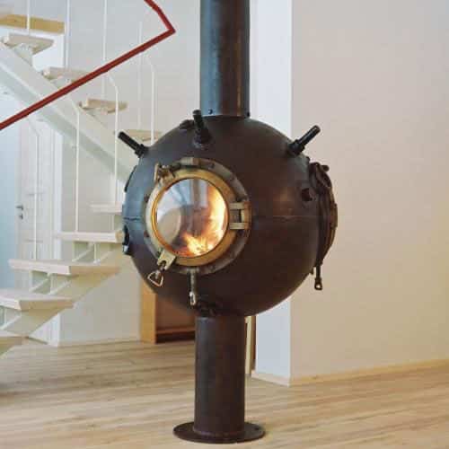 Fireplace made from a decommissioned naval mine Upcycling