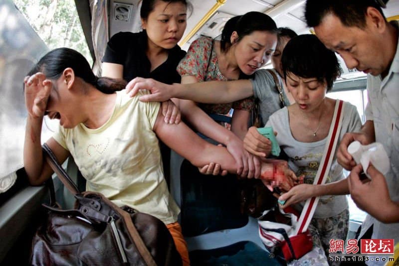 Public bus passengers try to rescue a woman who tried to commit suicide by slitting her wrist with a fruit knife Human Diversity